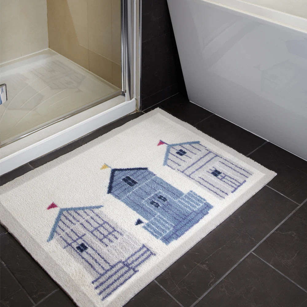 Eco-friendly washable bath mat with coastal beach hut design