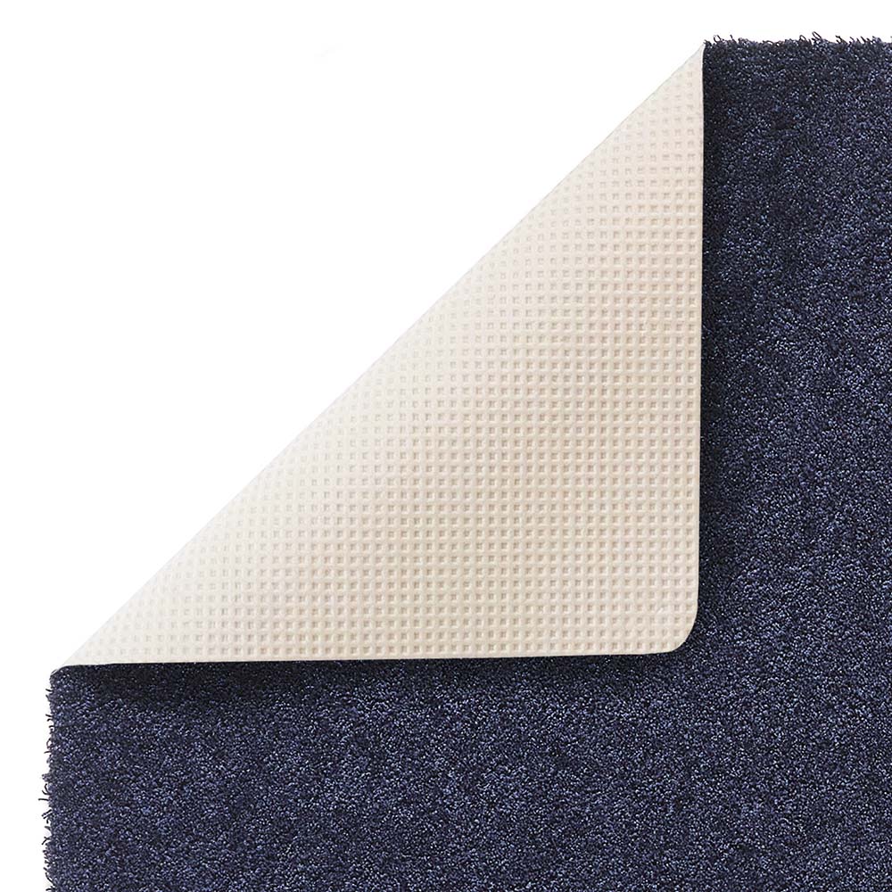Close-up of the super soft texture of the Hug Rug Sense Bath Mat in French Navy backing