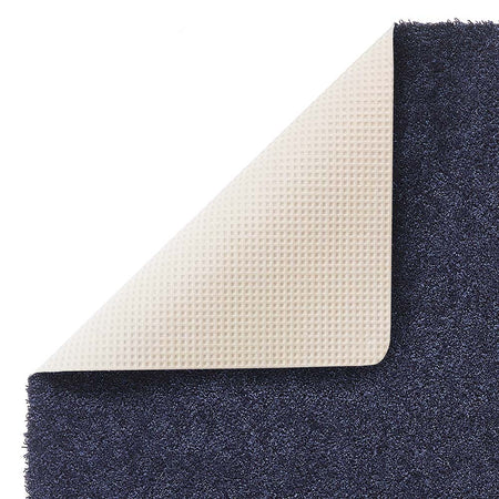 Close-up of the super soft texture of the Hug Rug Sense Bath Mat in French Navy backing