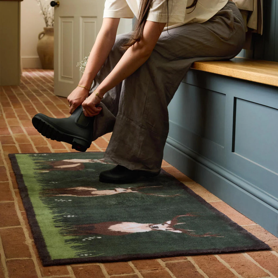 Dark green washable eco rug with deer design