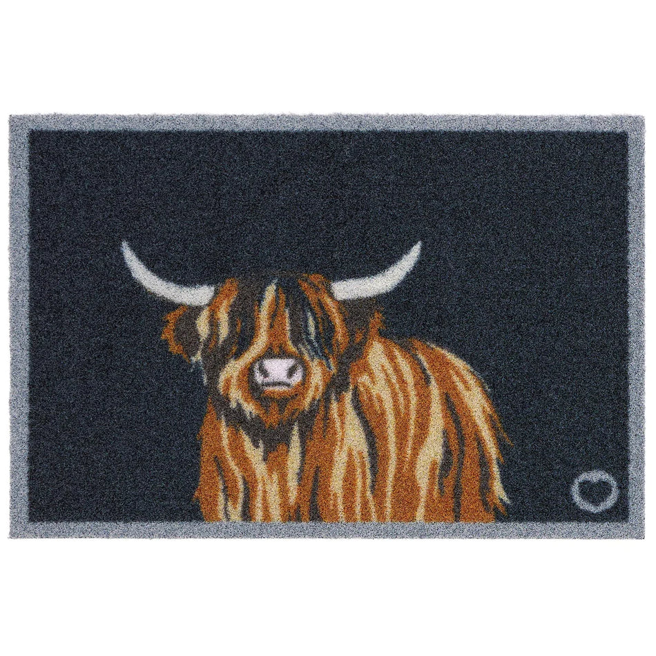 Doormat with a highland cow design on a dark blue background