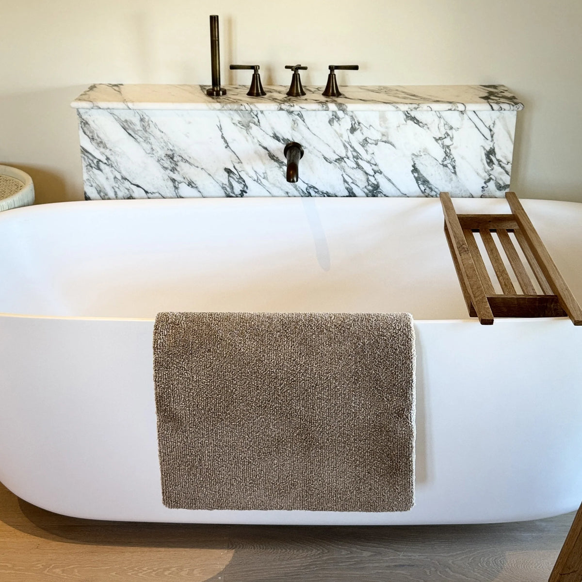 Close-up of the super soft texture of the Hug Rug Sense Bath Mat in Mink