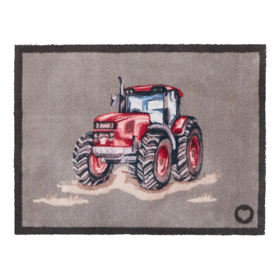 Hug Rug Red Farmyard Tractor front door mat on beige flooring