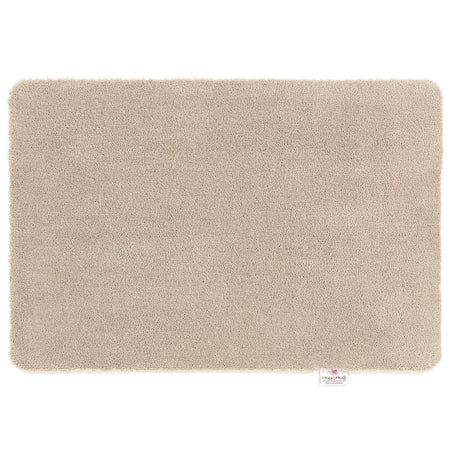 Hug Rug Sense Bath Mat in Beige displayed in a modern bathroom