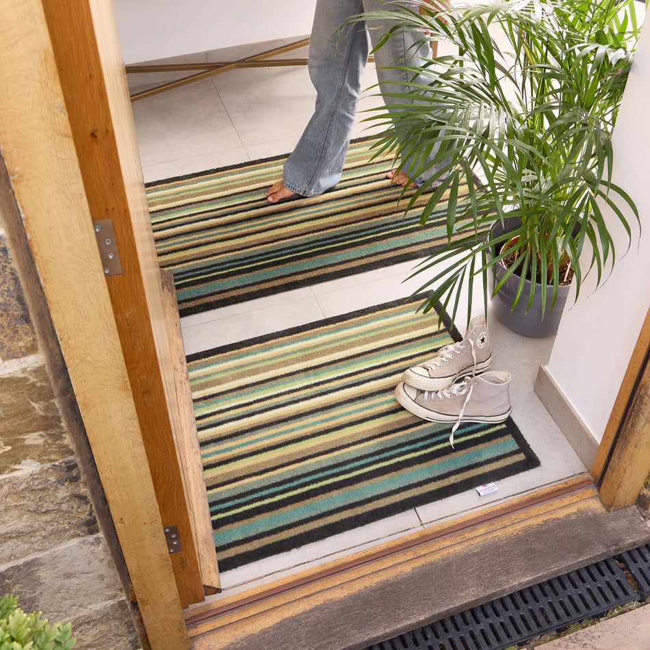 Navy-bordered Hug Rug with calming blue and grey tones