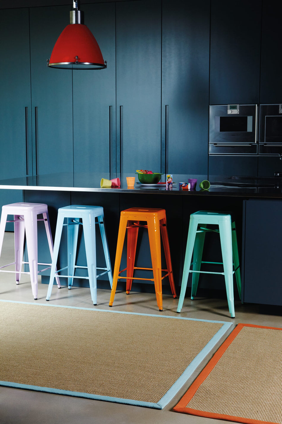 Sisal rug with aqua cotton border in kitchen