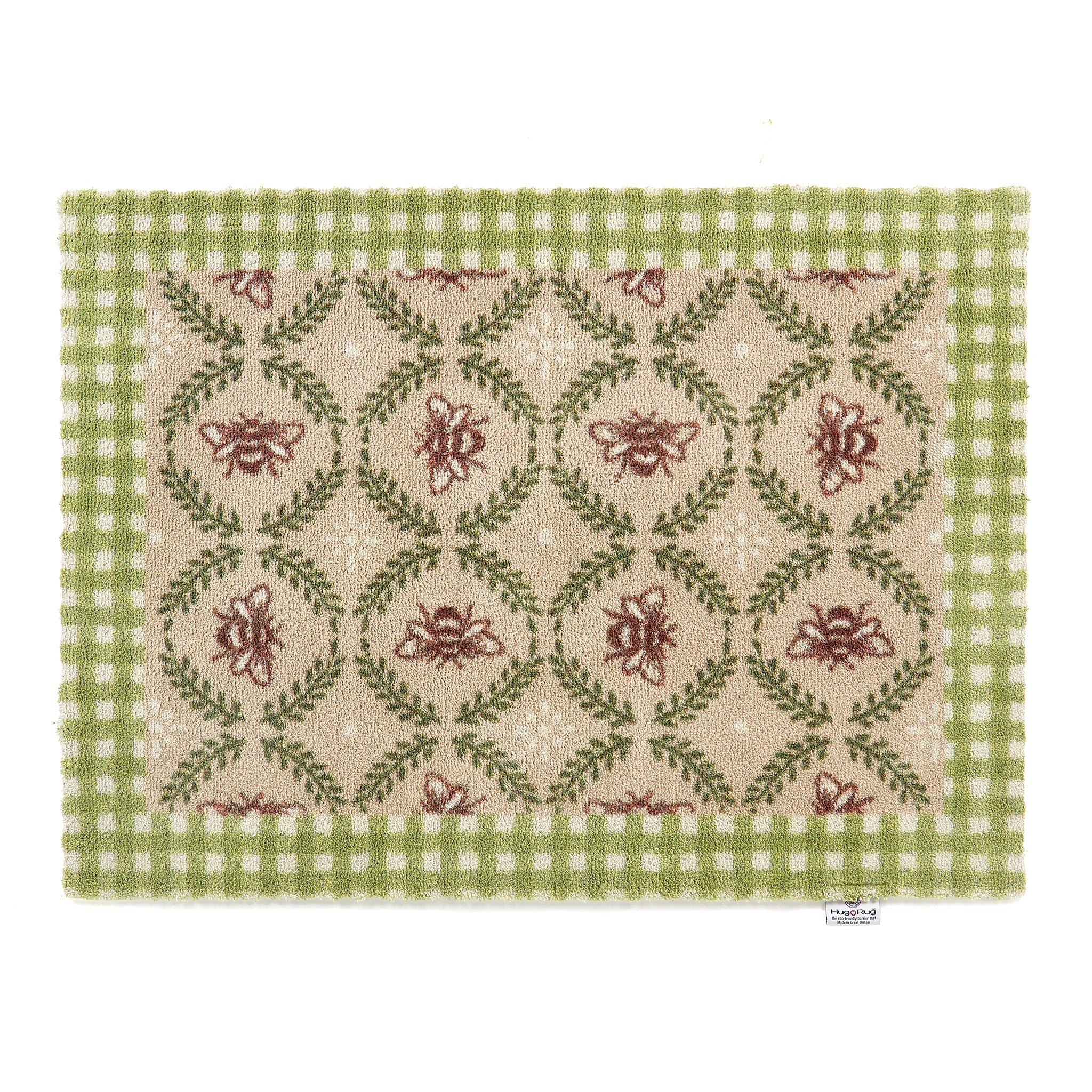 Decorative doormat with floral pattern and green border on a white background