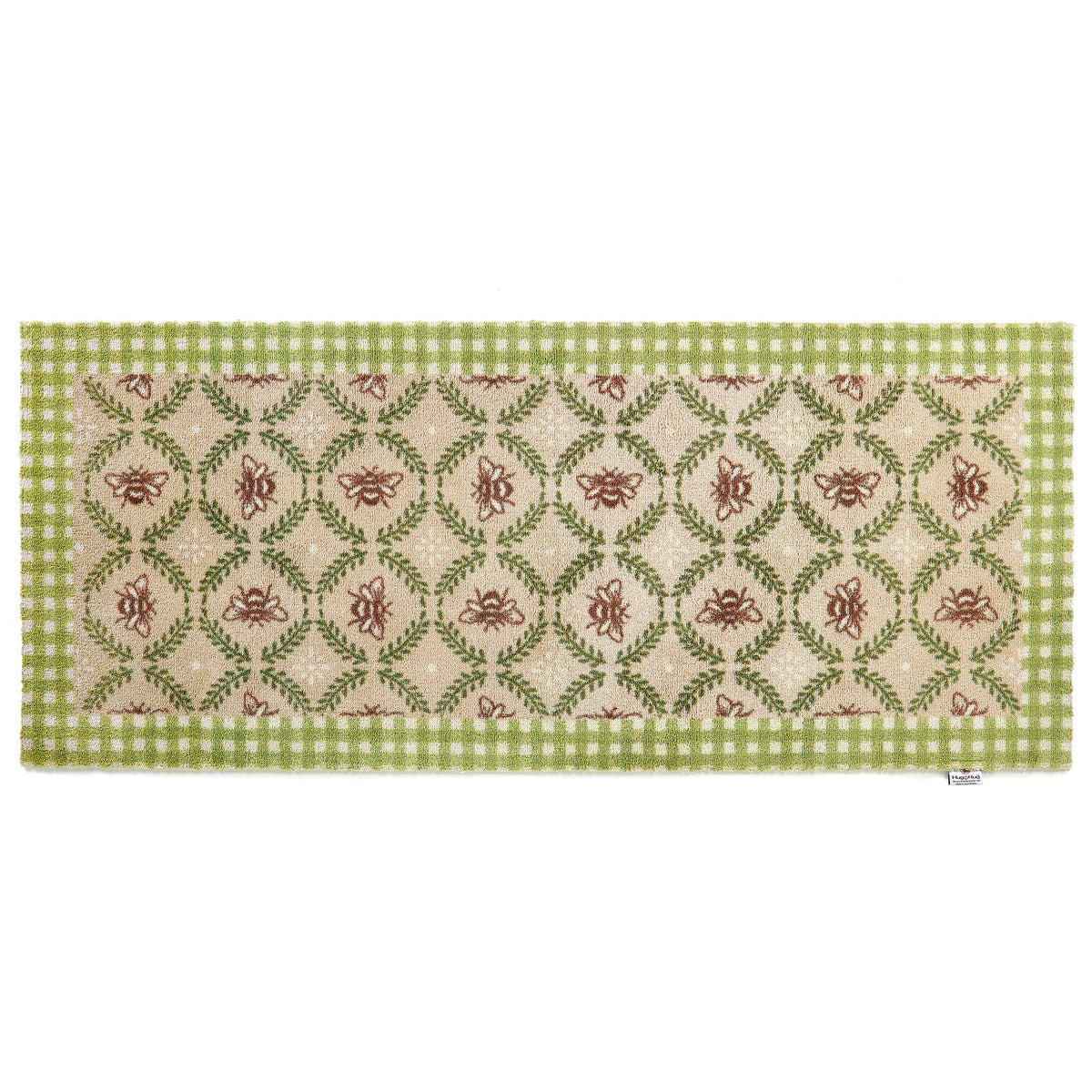 Decorative floor runner with green and beige pattern on a beige bee hive background