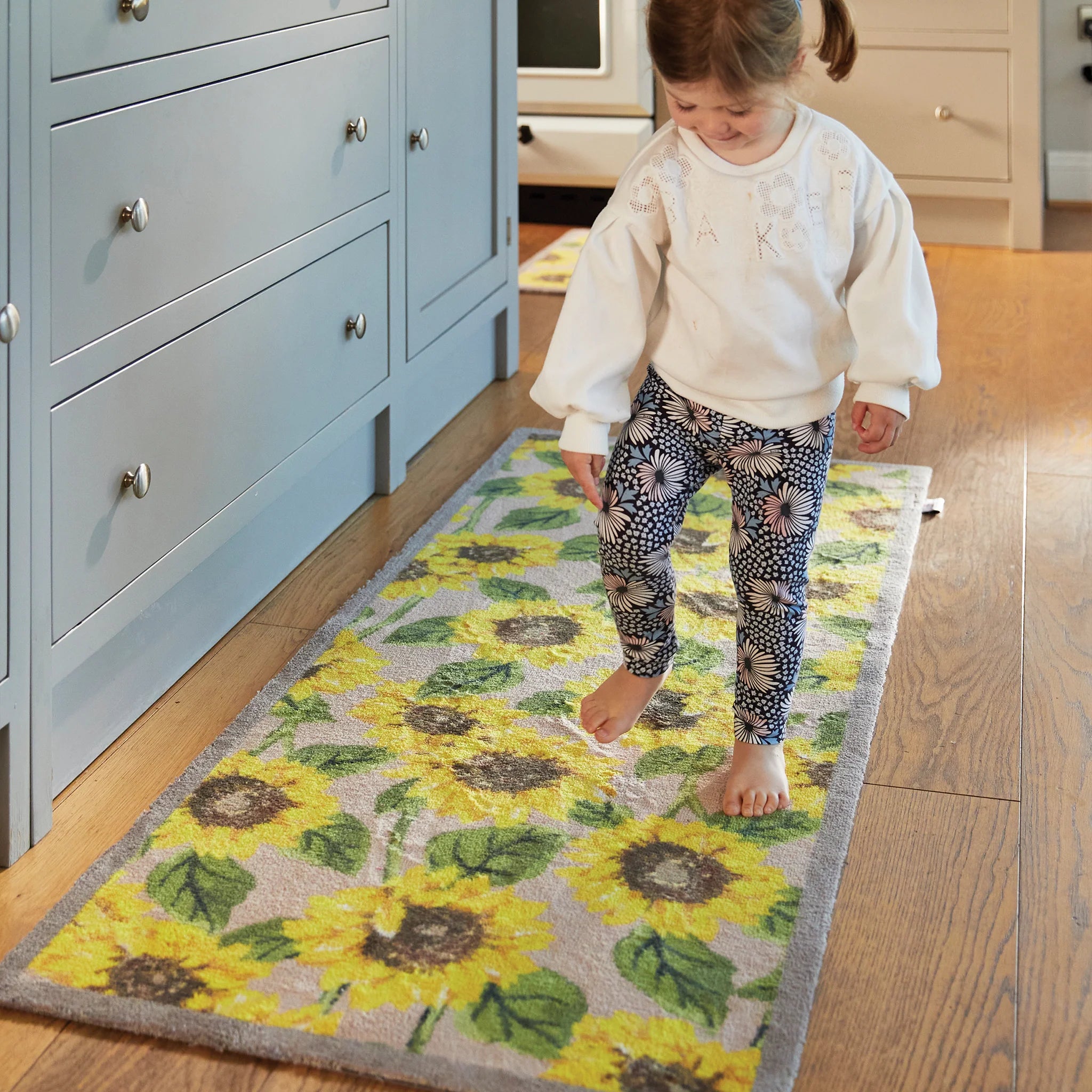 Bright floral Hug Rug on tile or wooden flooring