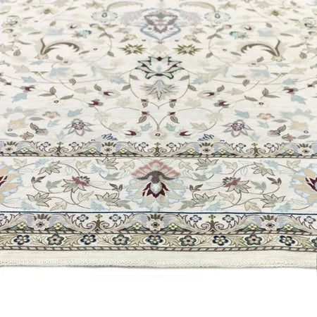Decorative floral-patterned rug with intricate designs on a white background