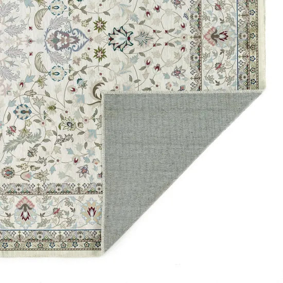 Patterned rug with floral design and gray border