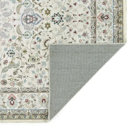 Patterned rug with floral design and gray border