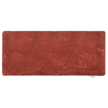 Red rectangular rug  runner on a white background