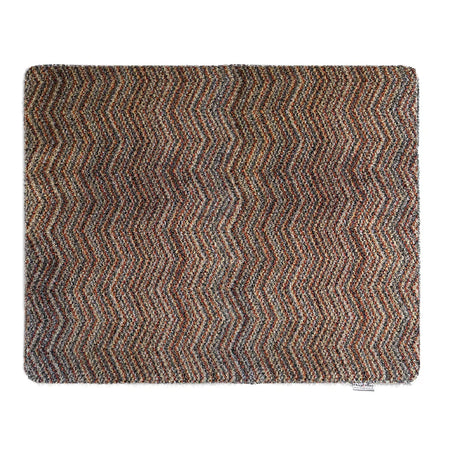 Textured zigzag patterned rug on a white background