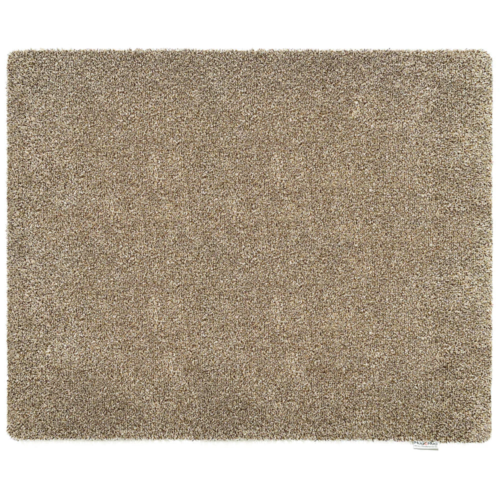 Beige shaggy rug on a white background