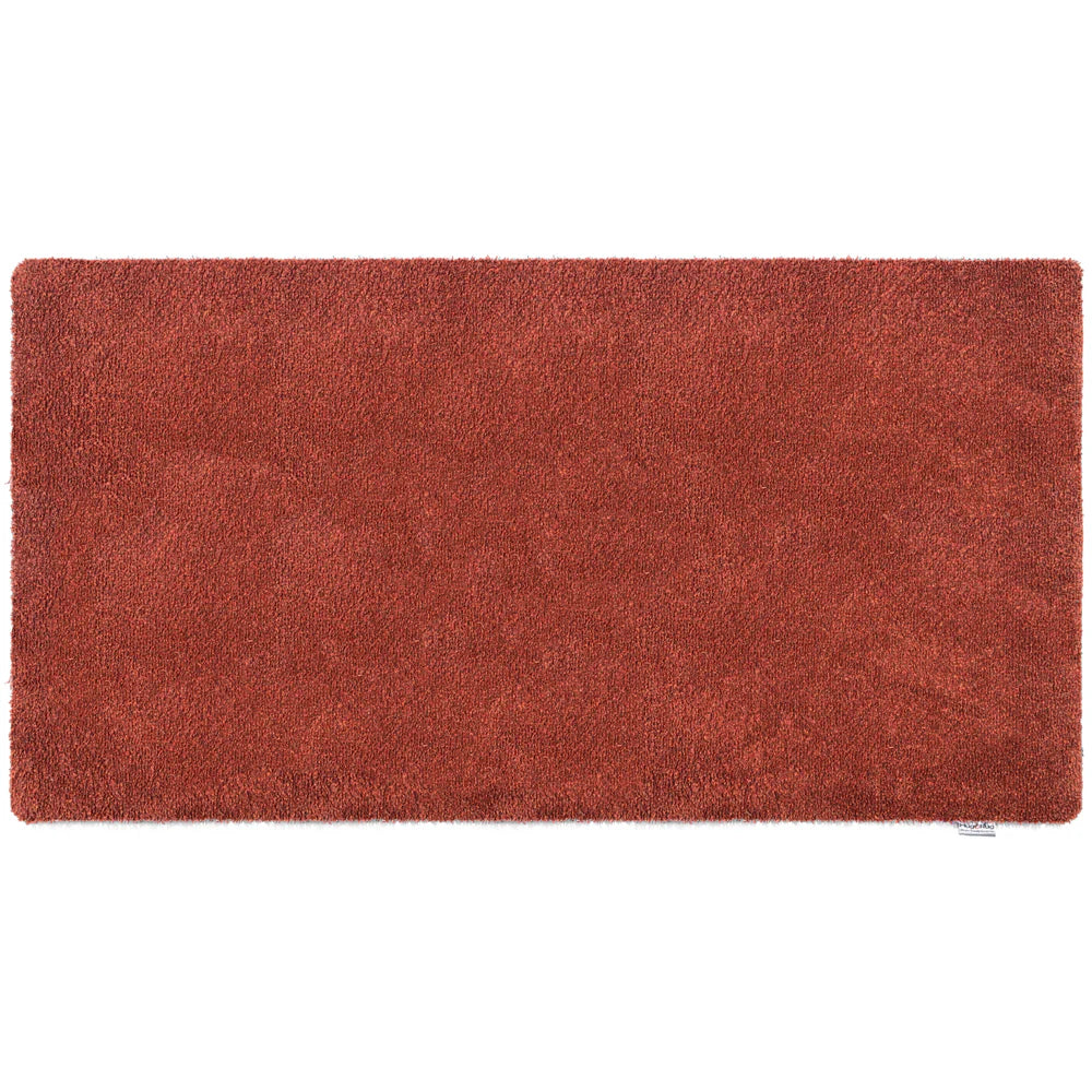 Rectangular red rug on a white background