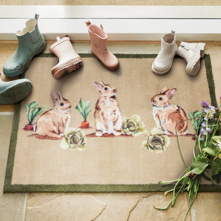 UK-made Hug Rug with playful bunny scene

