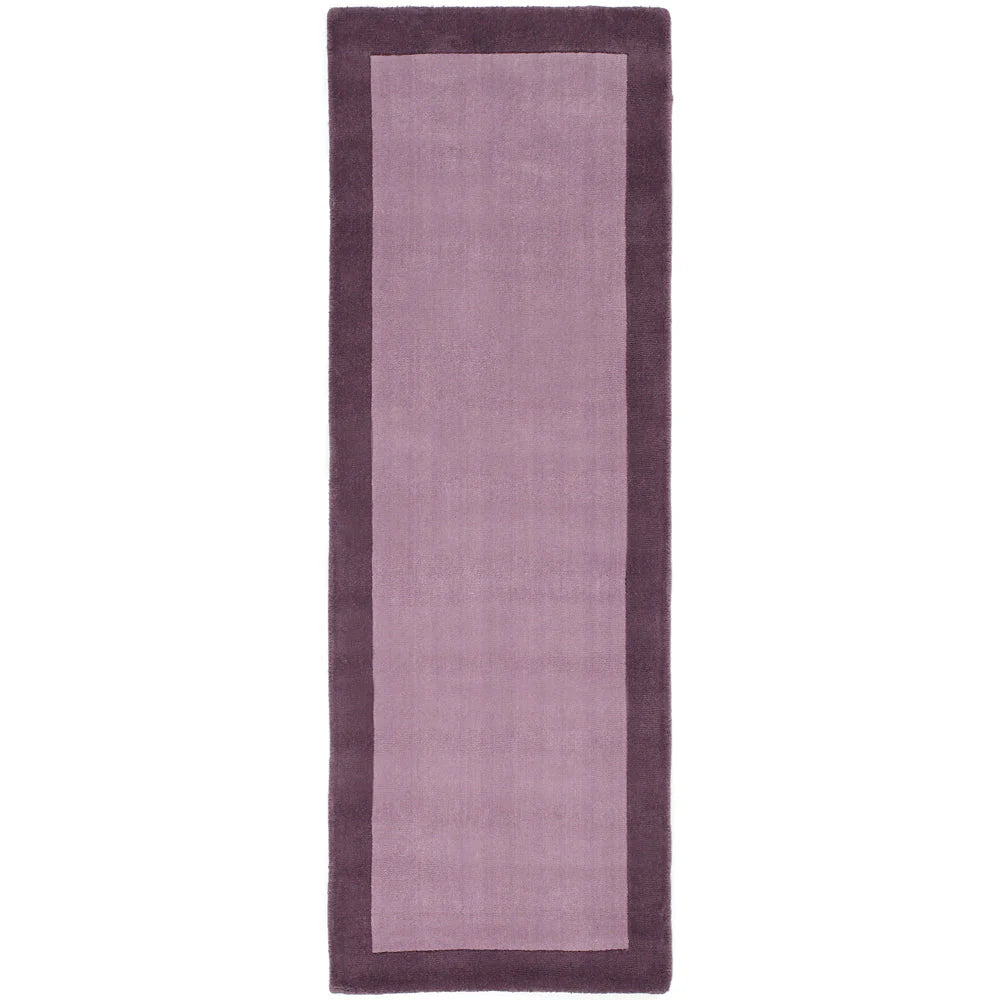 Rectangular purple rug with a solid color design on a white background