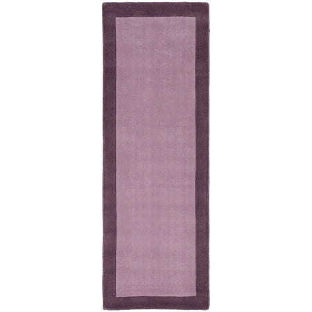Rectangular purple rug with a solid color design on a white background