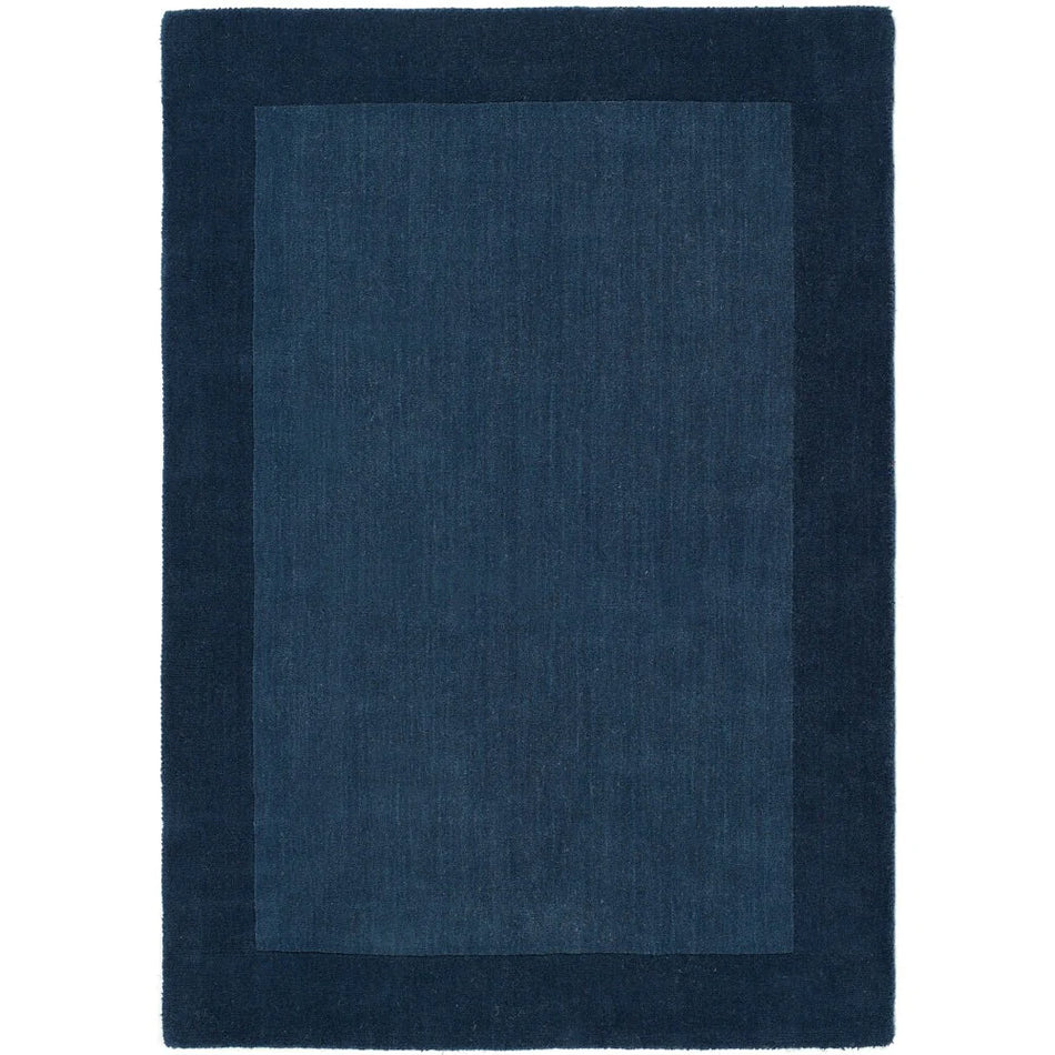 Rectangular blue rug on a white background