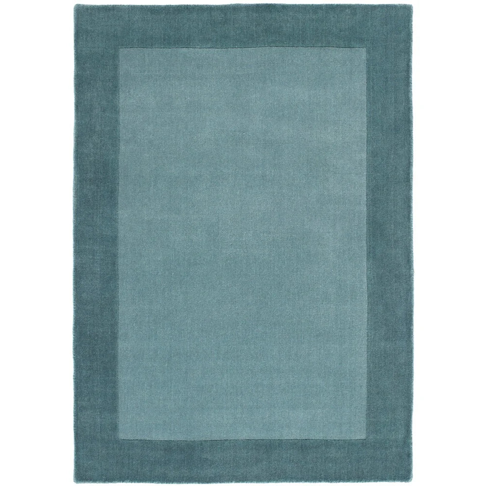 Duck egg wool rug with soft texture and subtle border