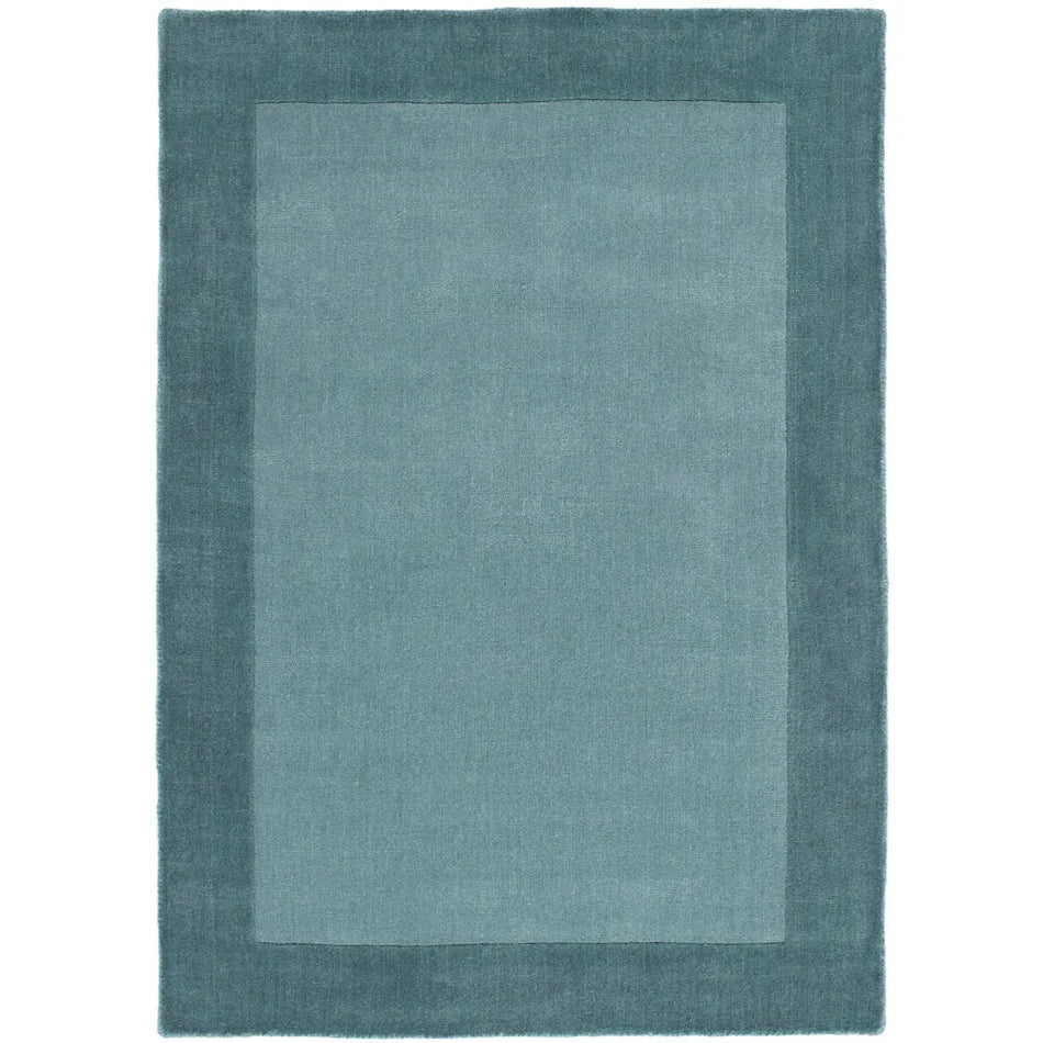 Duck egg wool rug with soft texture and subtle border