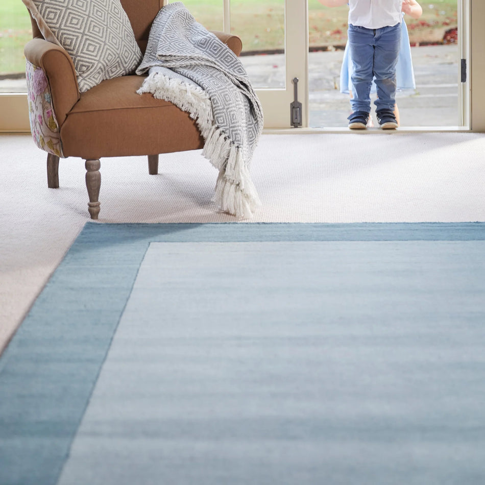 Hug Rug Origins Borders Duck Egg rug in soft blue tone