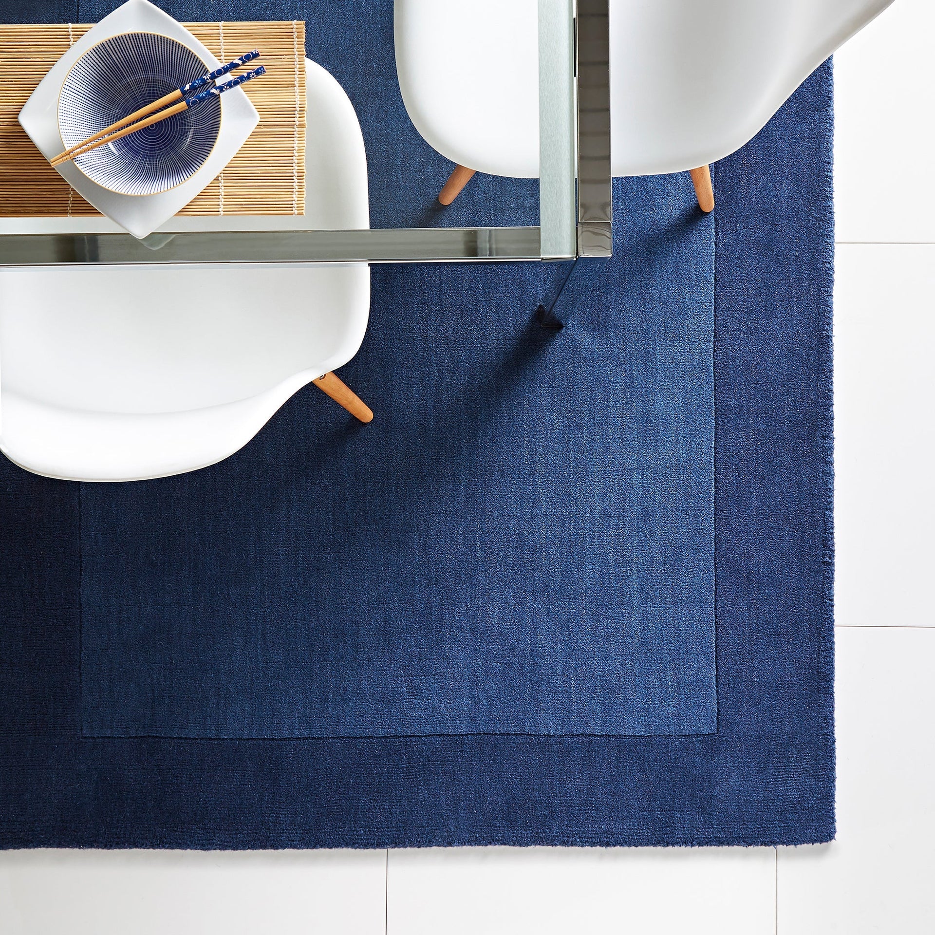 Hug Rug Origins Borders Navy wool rug in lounge