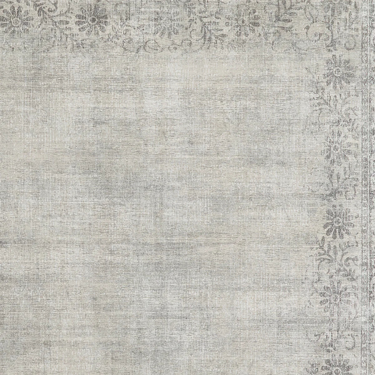 Textured gray area rug with decorative border