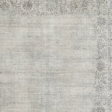 Textured gray area rug with decorative border