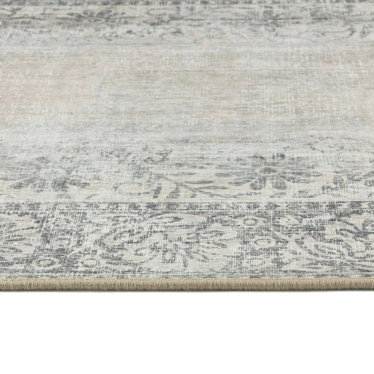 Textured area rug with a neutral color palette on a white background