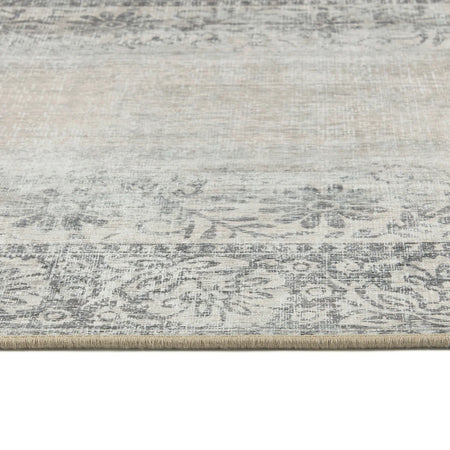 Textured area rug with a neutral color palette on a white background