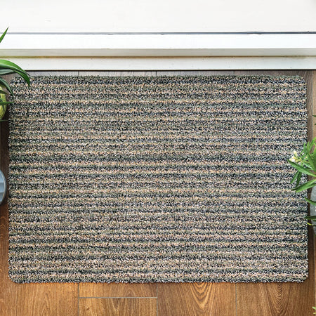 Close-up of Hug Rug soft sage green surface

