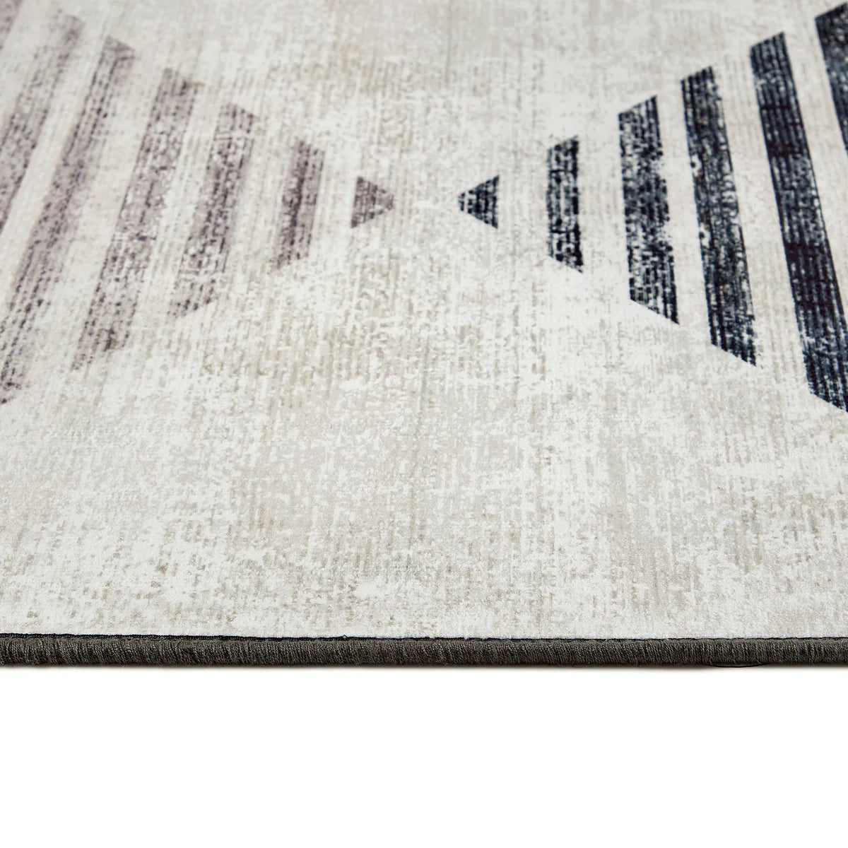 Close-up of a textured rug with geometric pattern