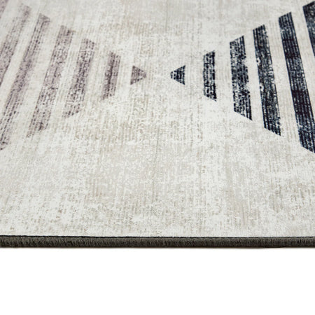 Close-up of a textured rug with geometric pattern