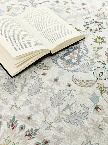Open book on a floral-patterned surface