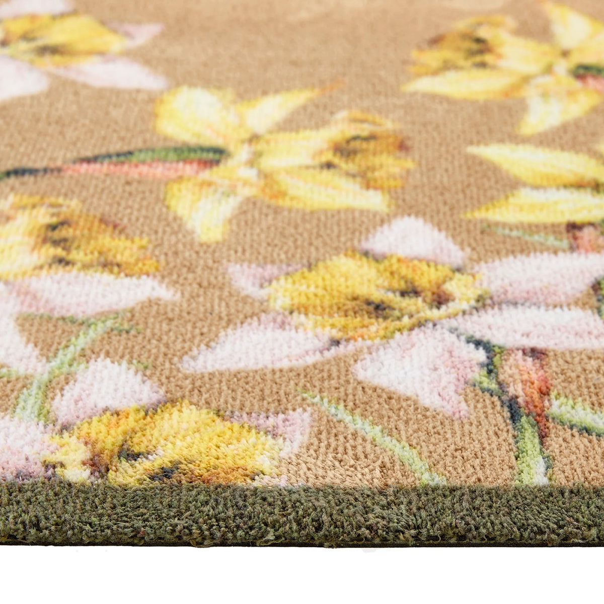 Close-up of Hug Rug daffodil design and cotton tufts

