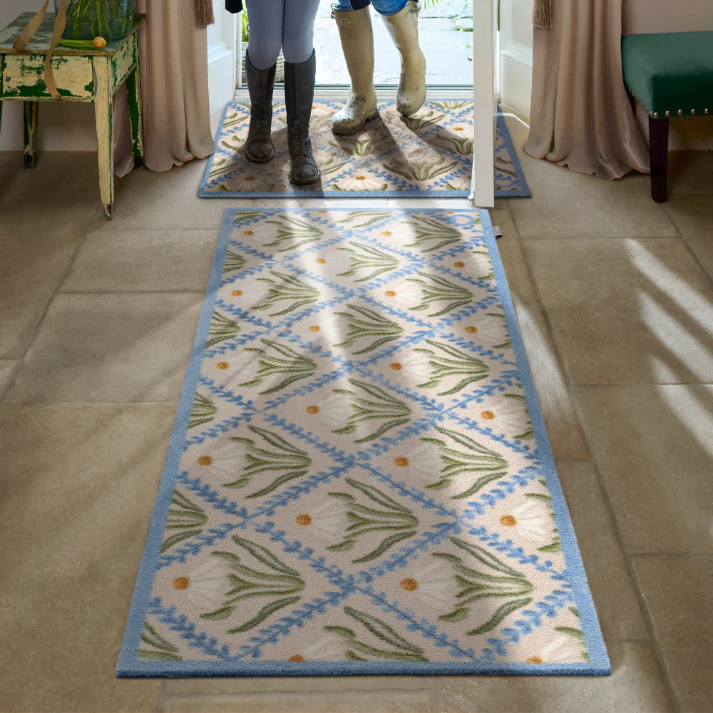 Hug Rug Daisy Trellis near entrance on tile flooring

