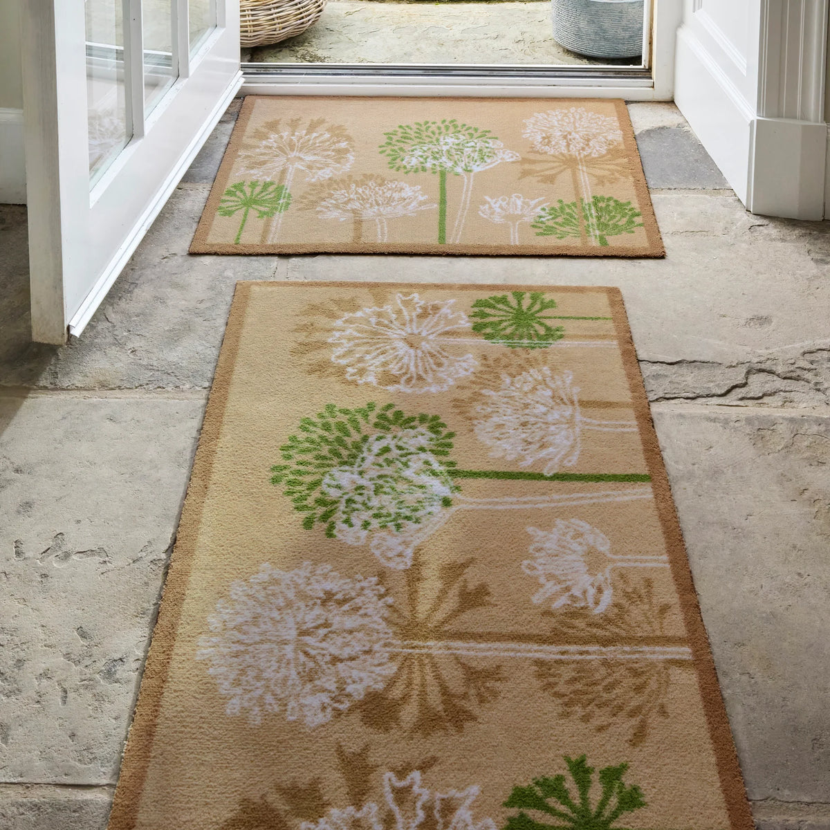 Hug Rug Dandelions catching dirt at front door

