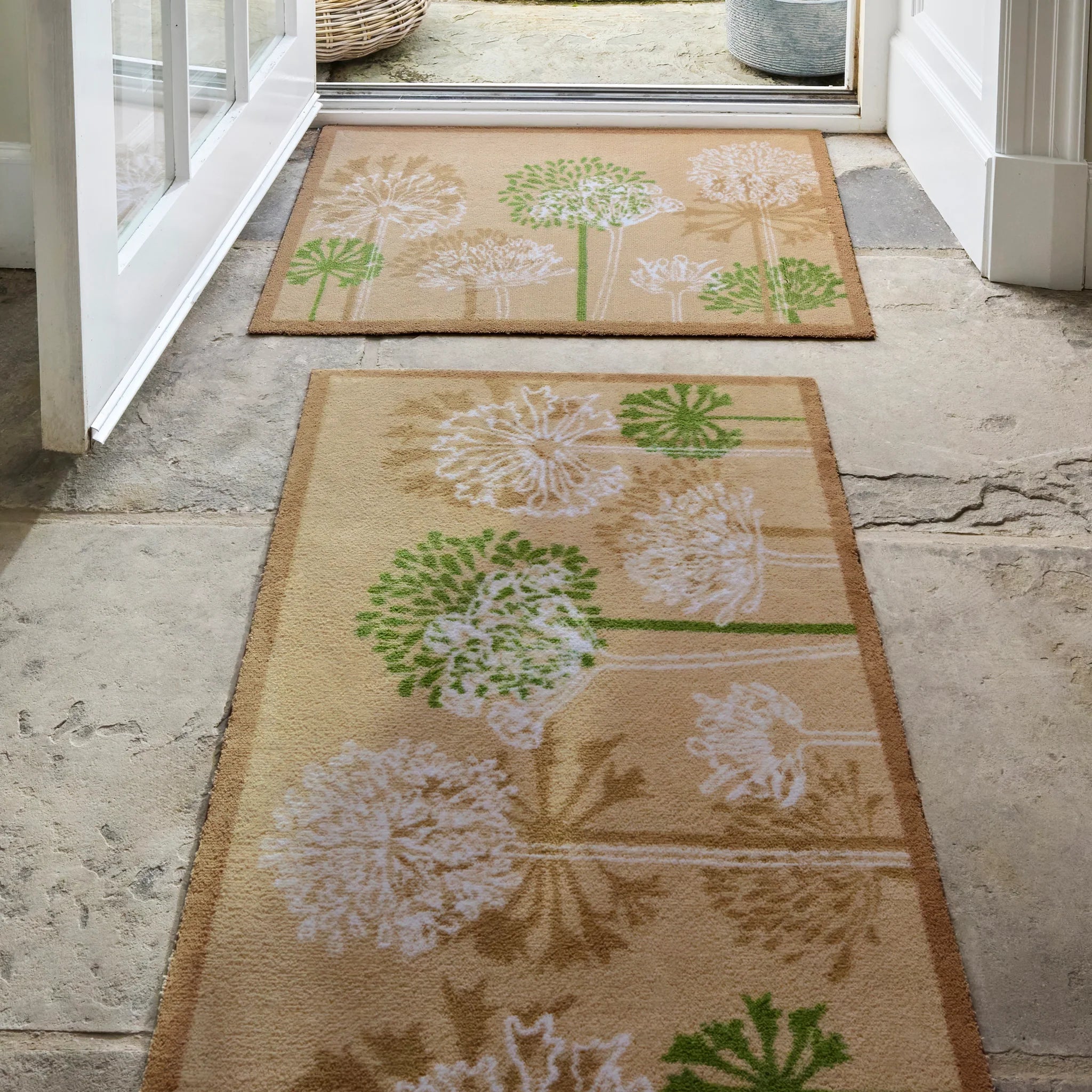 Hug Rug Dandelions catching dirt at front door


