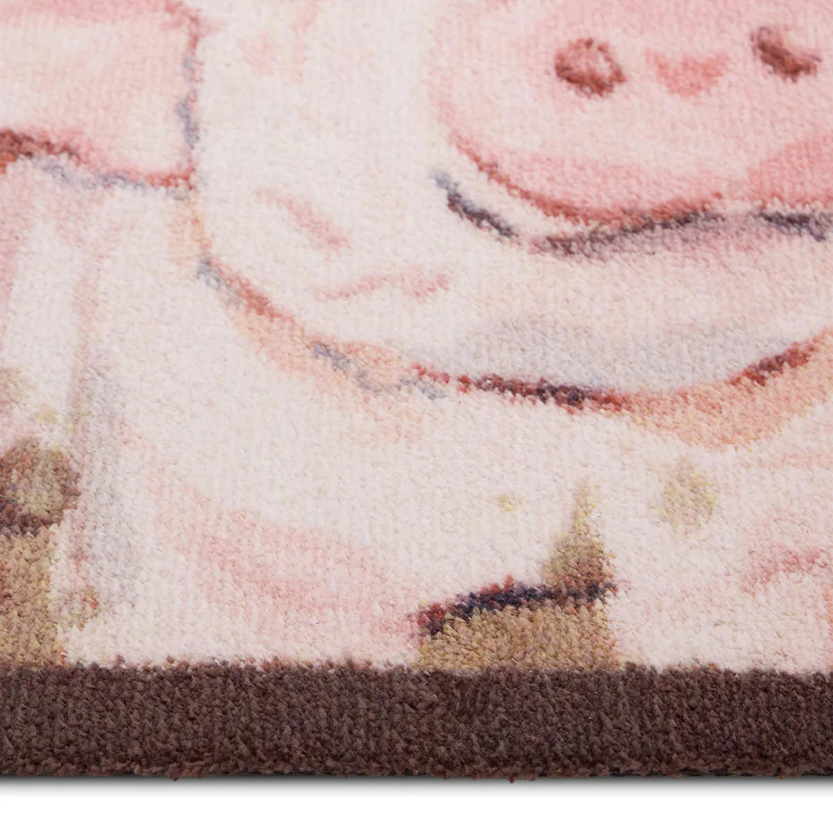 Close-up of a rug with a cartoon character design on a white background