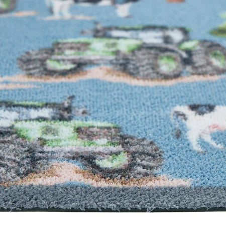 Close-up of Hug Rug tractors and cow illustrations

