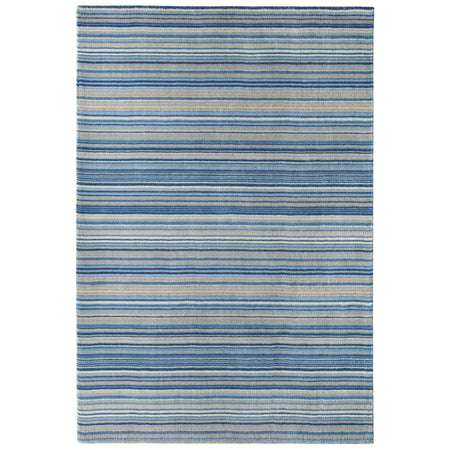 origins Striped blue and gray rug on a white background