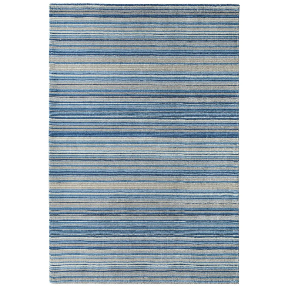 origins Striped blue and gray rug on a white background