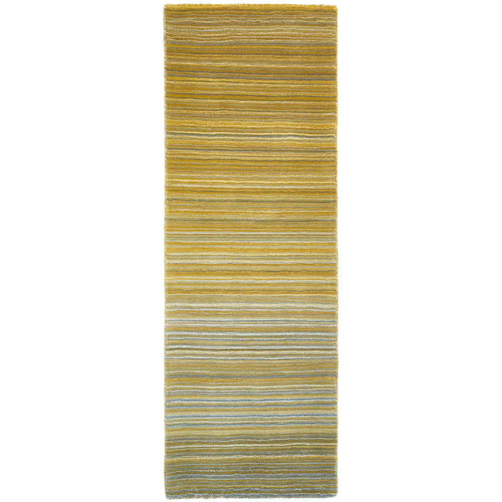 Striped yellow and green rug on a white background
