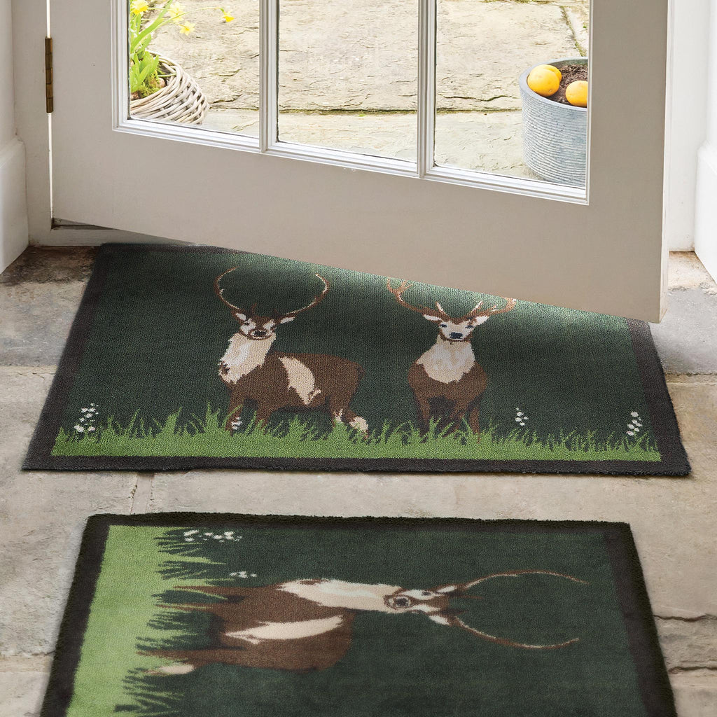 hug rug green deer mat and runner in hallway entrance
