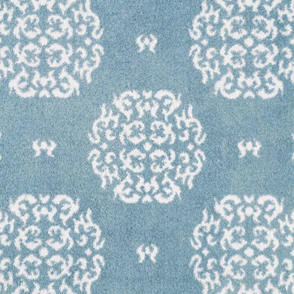 Close-up of Hug Rug heart and house design

