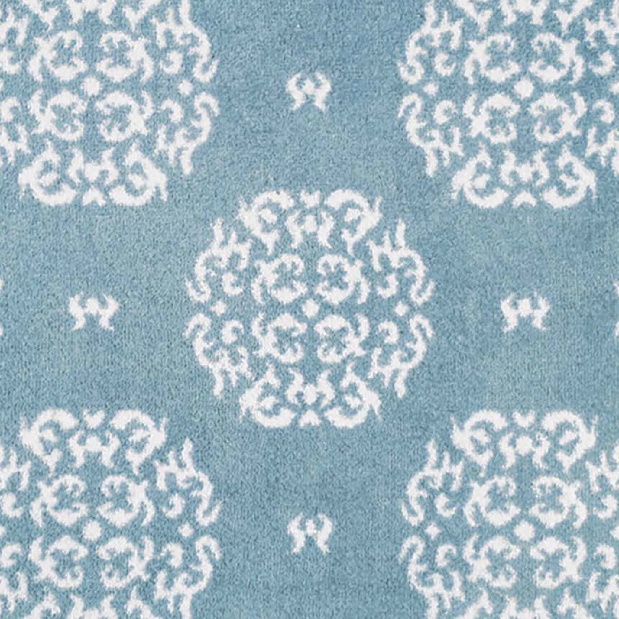 Close-up of Hug Rug heart and house design

