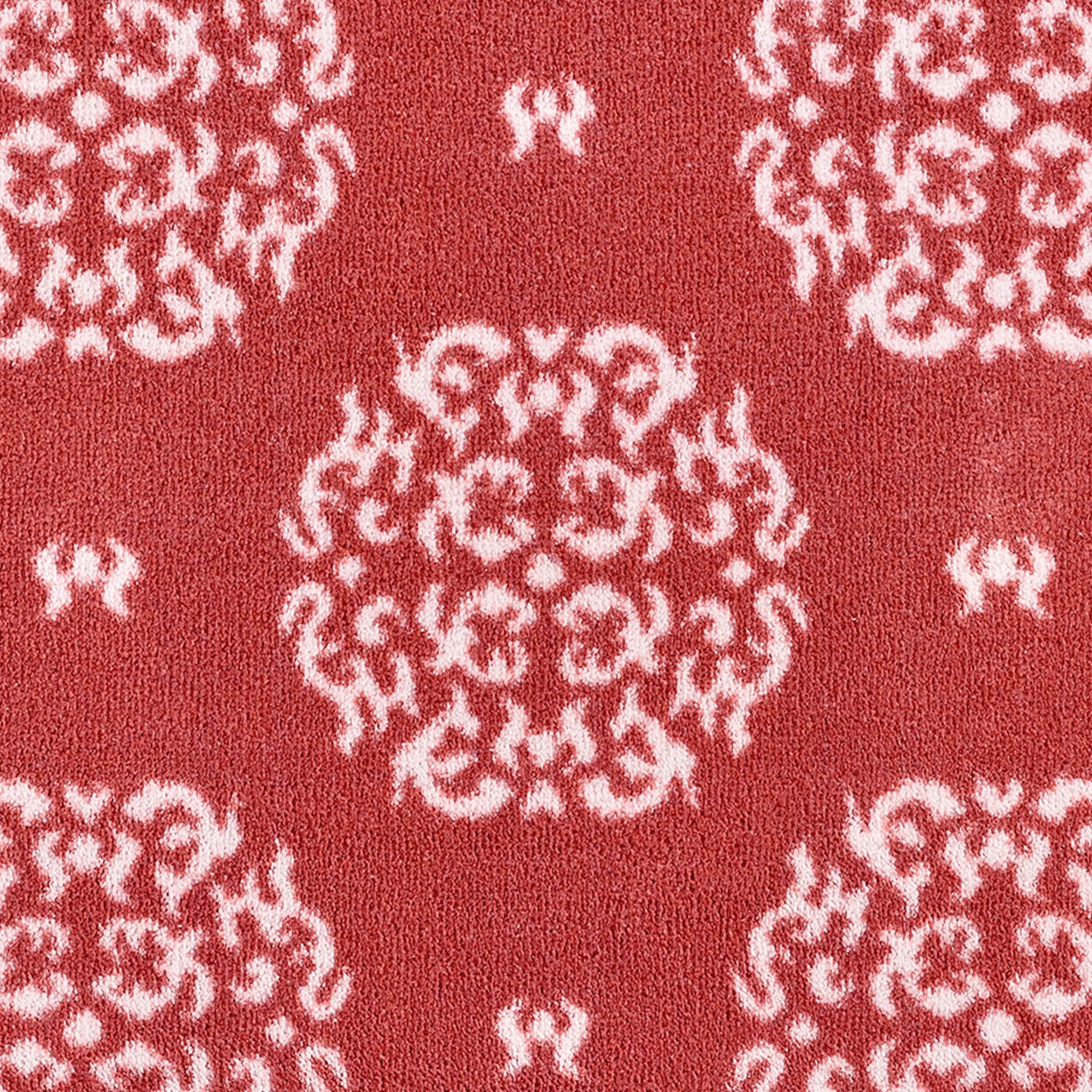 Close-up of Hug Rug heart and house design

