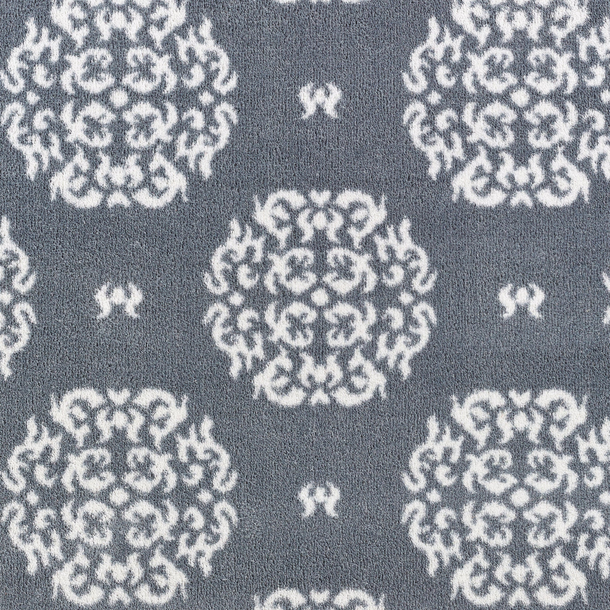 Close-up of Hug Rug heart and house design
